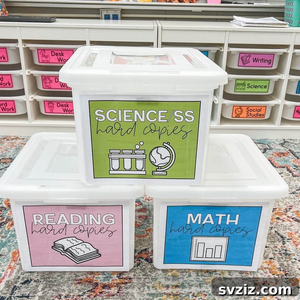 17 Genius School Office Organization Hacks 4 Labeled clear plastic containers for organizing hard copy subject materials in a classroom.