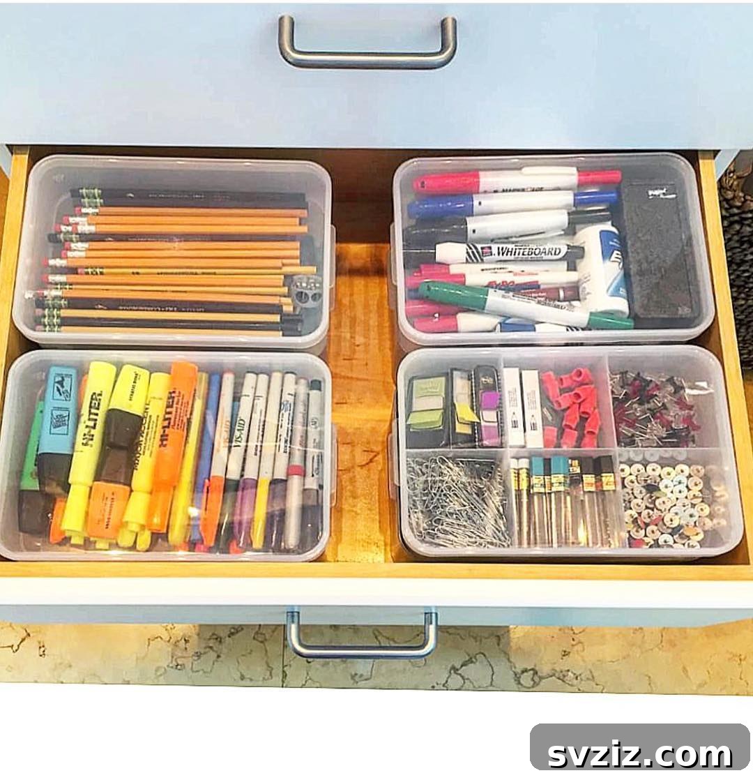 17 Genius School Office Organization Hacks 5 Miniature boxes within a desk drawer, neatly organizing small office supplies like paperclips and pushpins.
