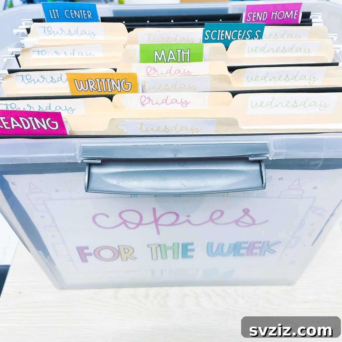17 Genius School Office Organization Hacks 7 Clear file box with dividers used to organize a week's lesson plans and handouts.