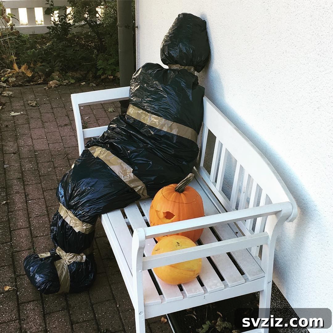 Halloween yard prop of a dead body wrapped in plastic bags