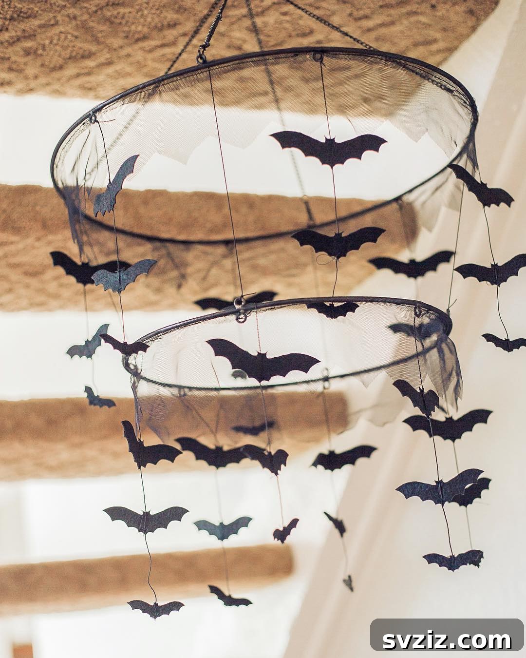 Spine-Chilling Interiors: 31 Scary Halloween Decor Ideas 21 bat chandelier
