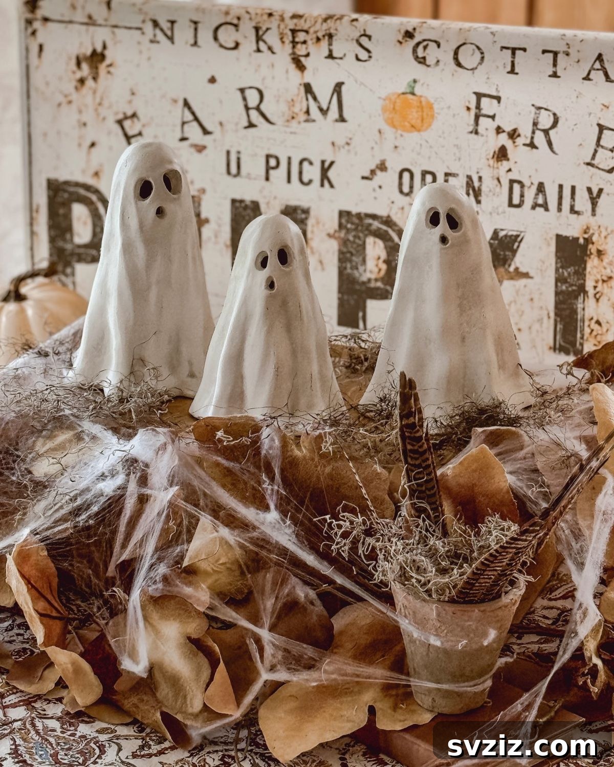 Spine-Chilling Interiors: 31 Scary Halloween Decor Ideas 30 ceramic ghosts