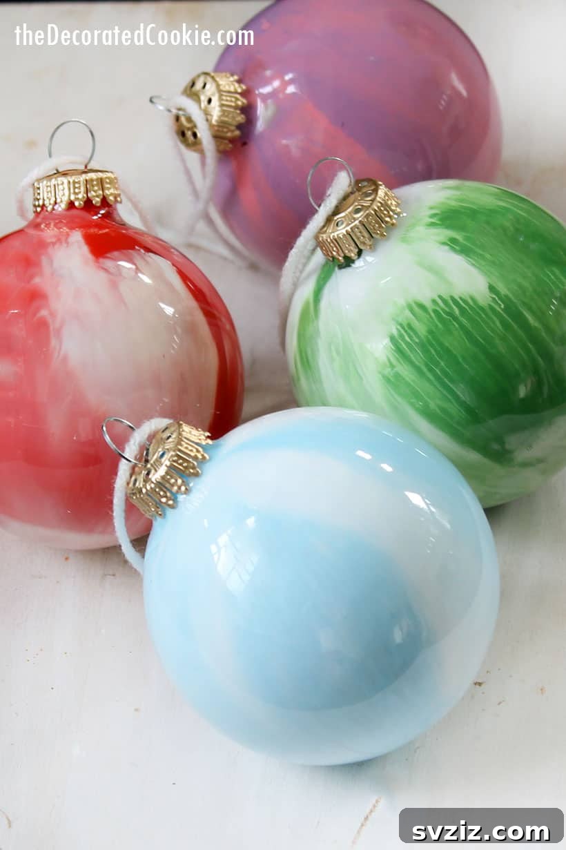 41 Quick & Easy Christmas Crafts to Finish in 15 Minutes 26 Vibrant Paint Swirl Ornaments for a Kid-Friendly Christmas Craft