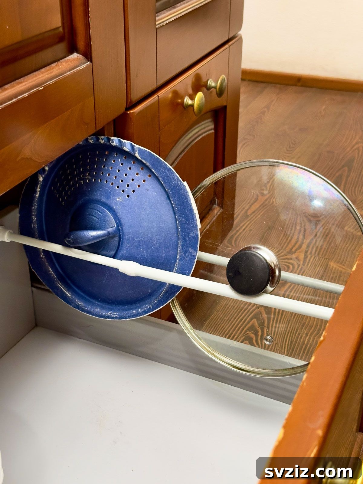  Use a Tension Rod to Organize Lids