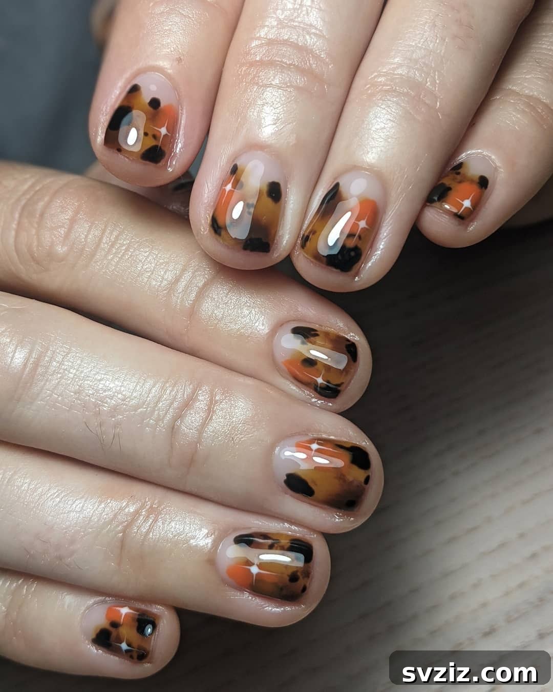 Tortoise shell pattern nail art on short nails