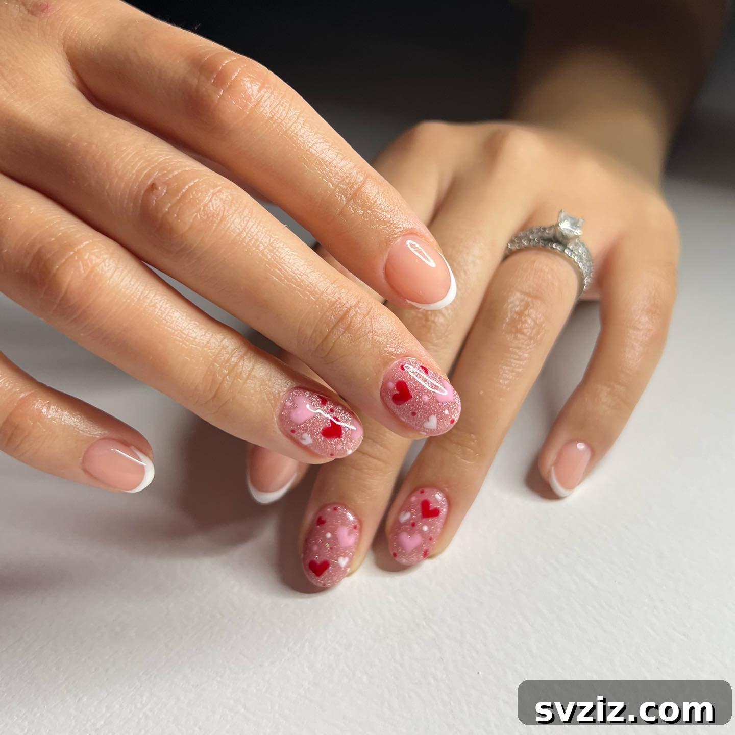 Structure gel manicure with tiny red and pink hearts on short nails