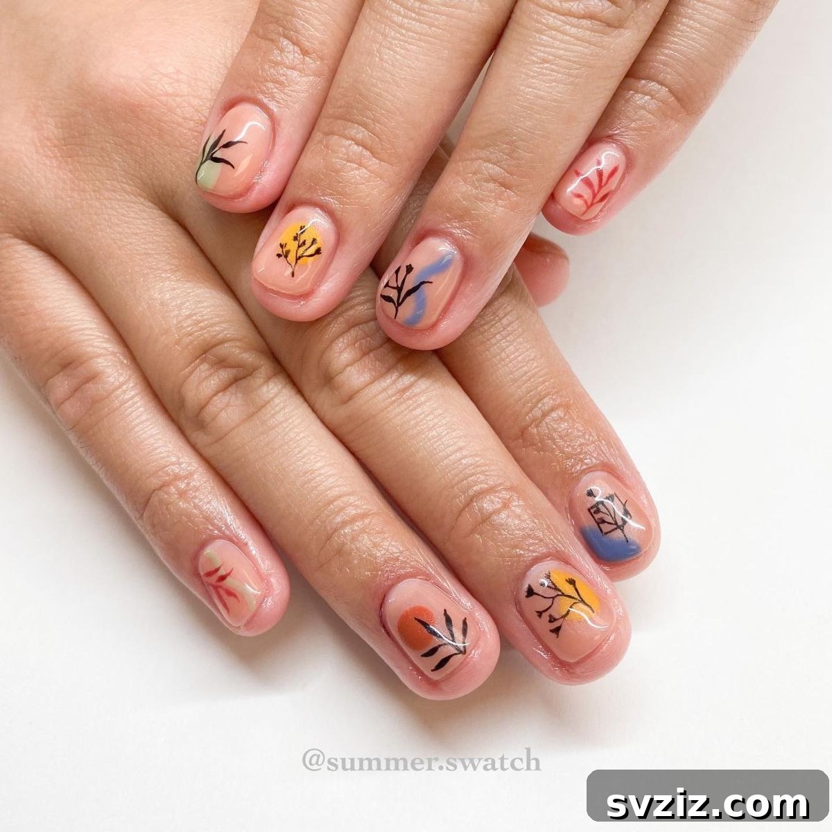 Summer floral and leafy nail art on short nails with a nude base