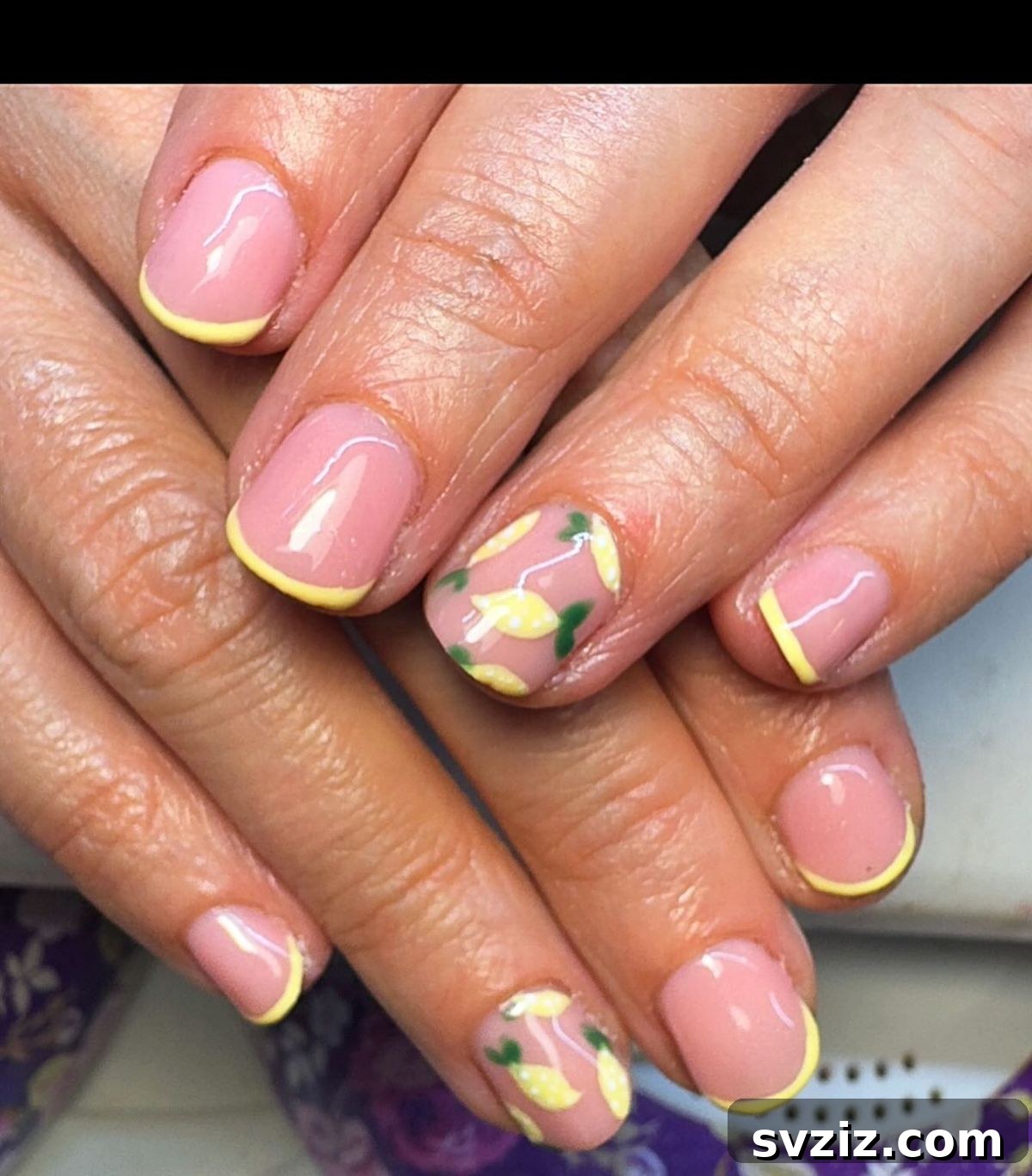 Cute lemon nail art on short nails with yellow and green accents
