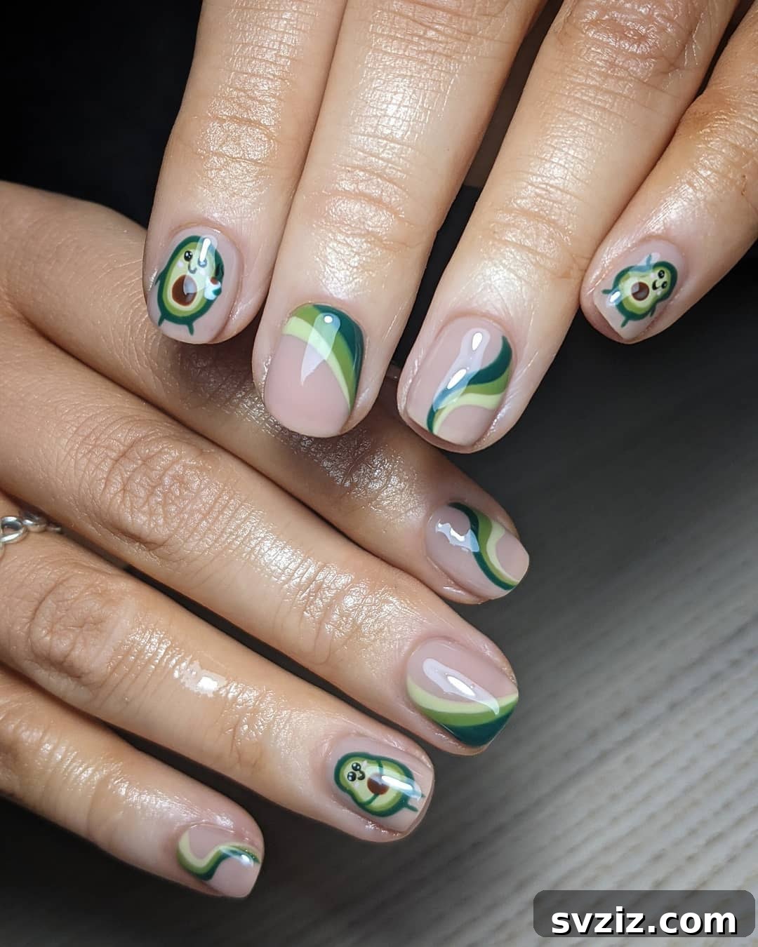 Cute avocado nail art design on short nails