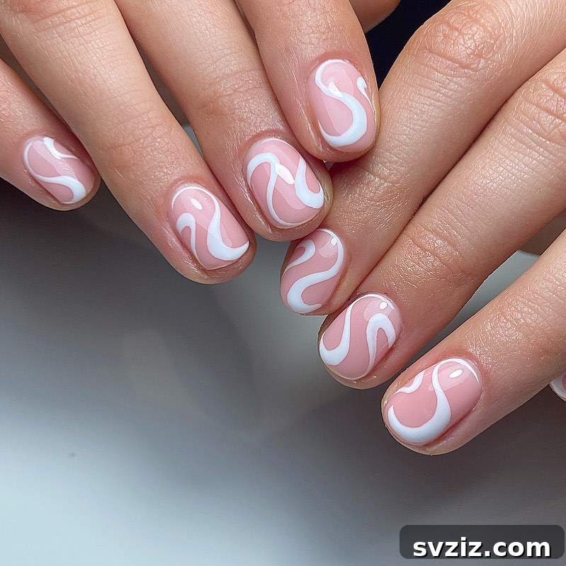Elegant white swirl nail art on short nails
