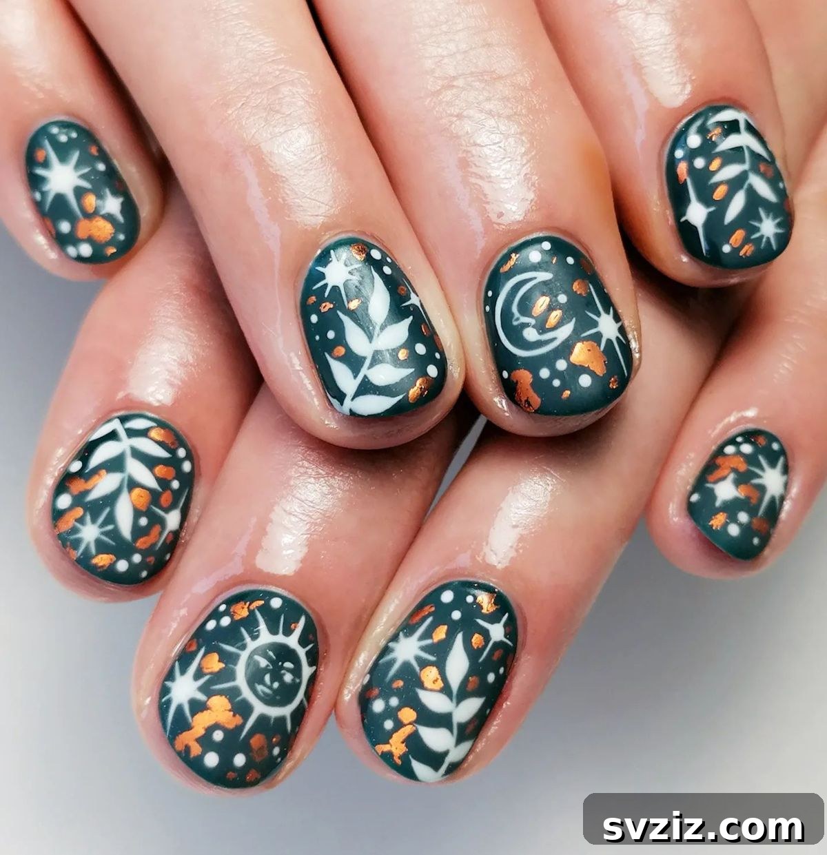 Celestial forest themed nail art with green base and gold accents