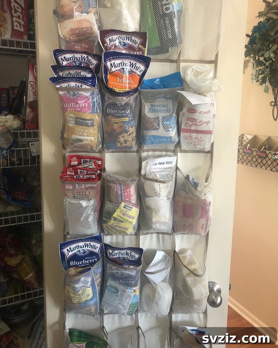 17 Ingenious Hanging Organizers to Maximize Vertical Space 14 Over-the-door snack organizer for pantry