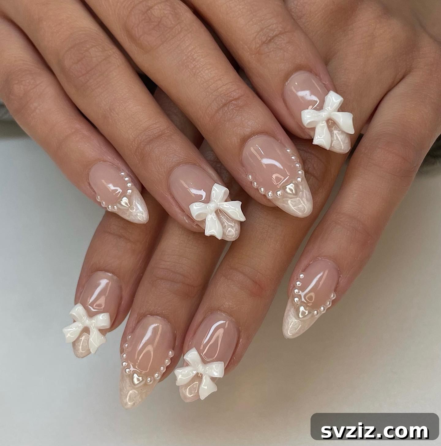 Stunning Bridal Nail Art Inspiration 15 Sweet white bow details on elegant bridal nails