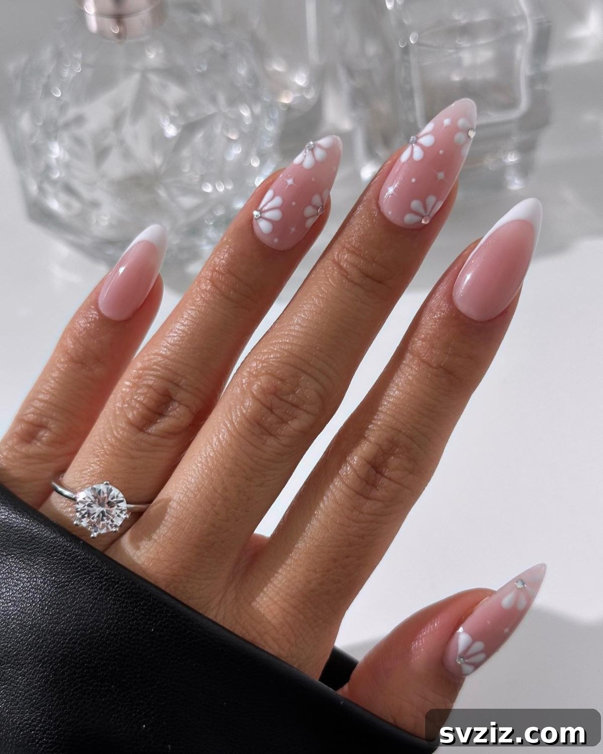 Stunning Bridal Nail Art Inspiration 3 Delicate white floral wedding nail art with subtle rhinestones