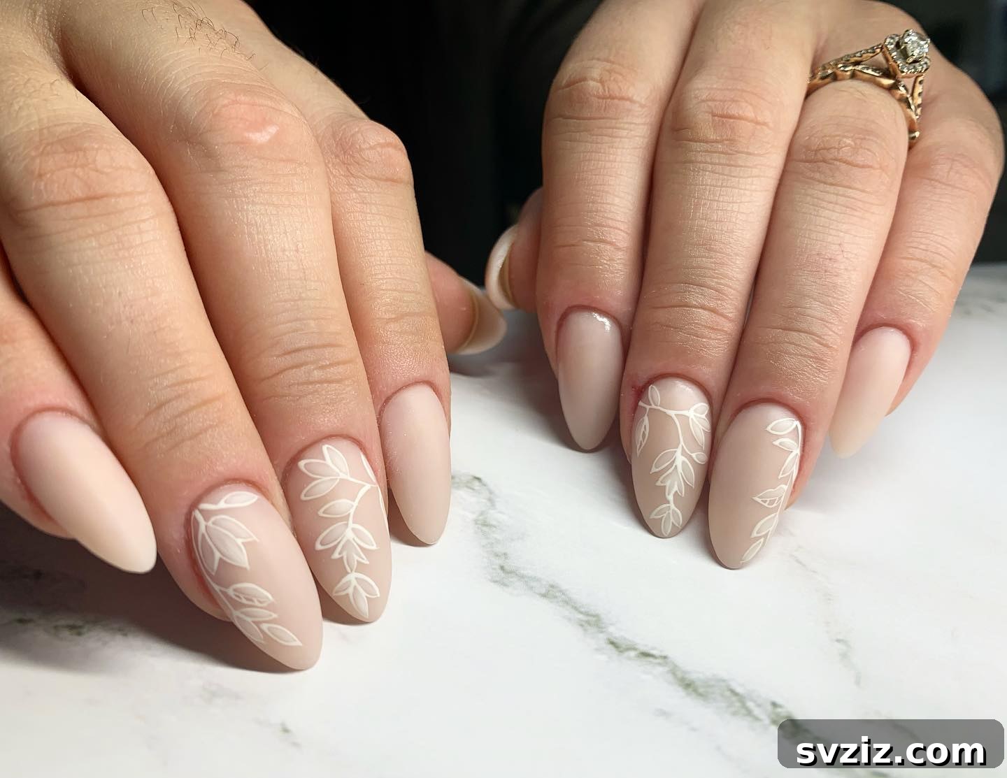 Stunning Bridal Nail Art Inspiration 22 Understated neutral wedding nails with delicate floral accents