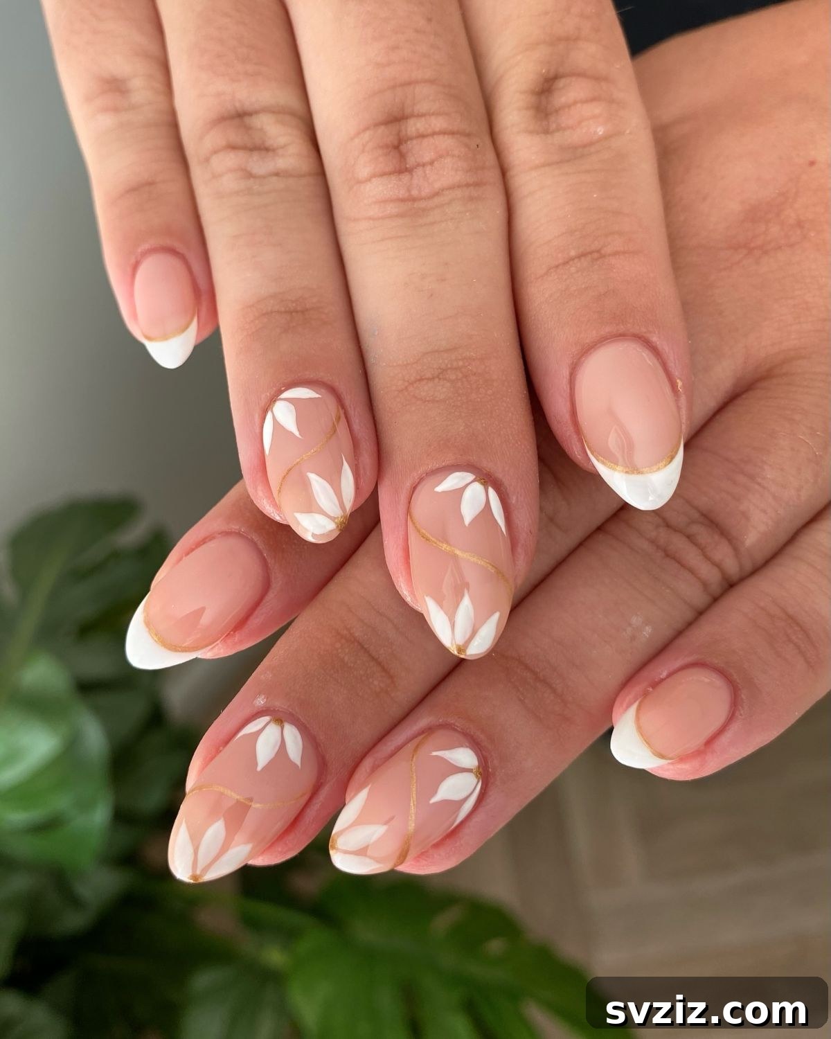 Stunning Bridal Nail Art Inspiration 30 Ethereal soft white floral nails with subtle gold swirl accents