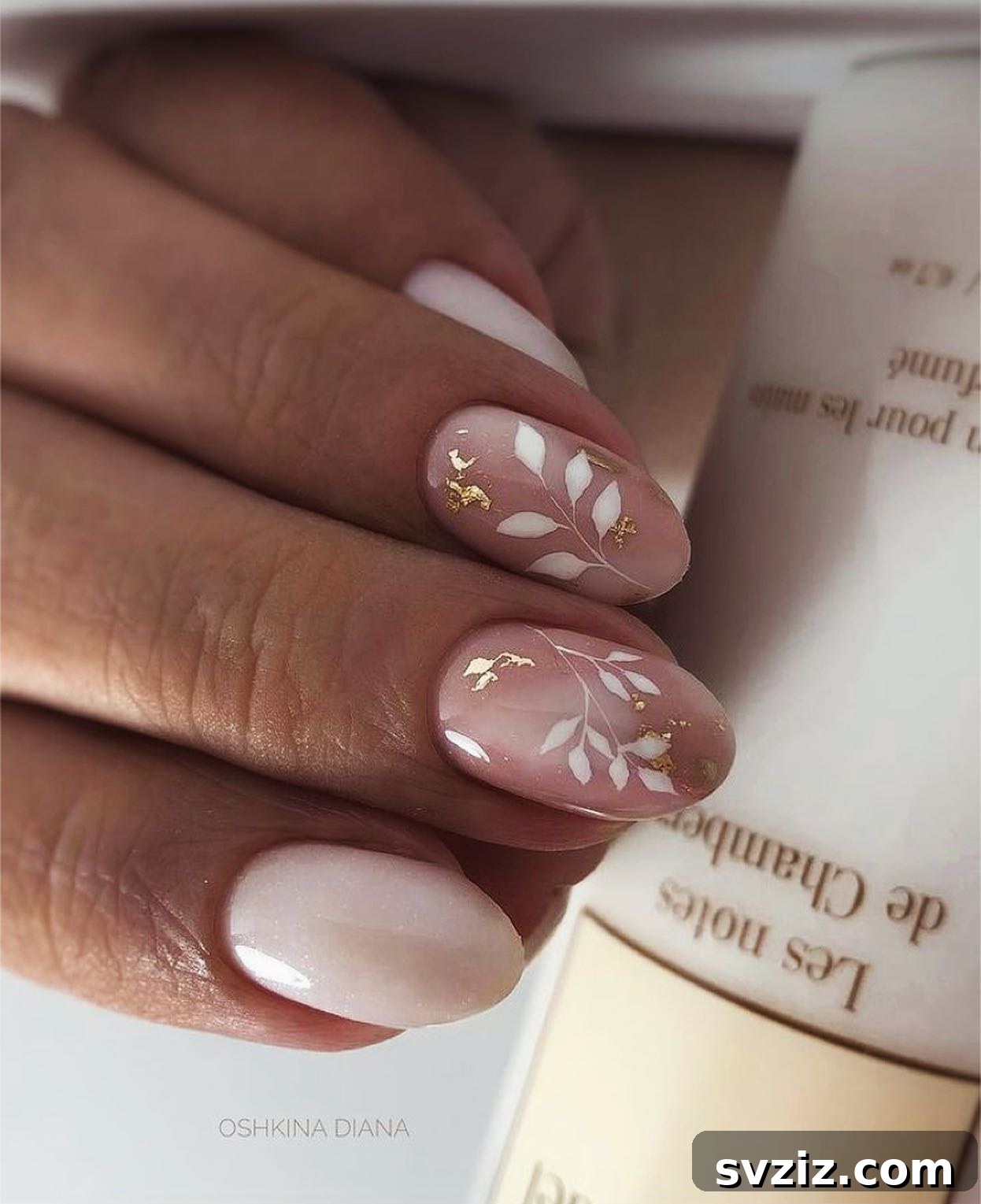 Stunning Bridal Nail Art Inspiration 4 Elegant white leaf nail design with gold accents perfect for an outdoor wedding