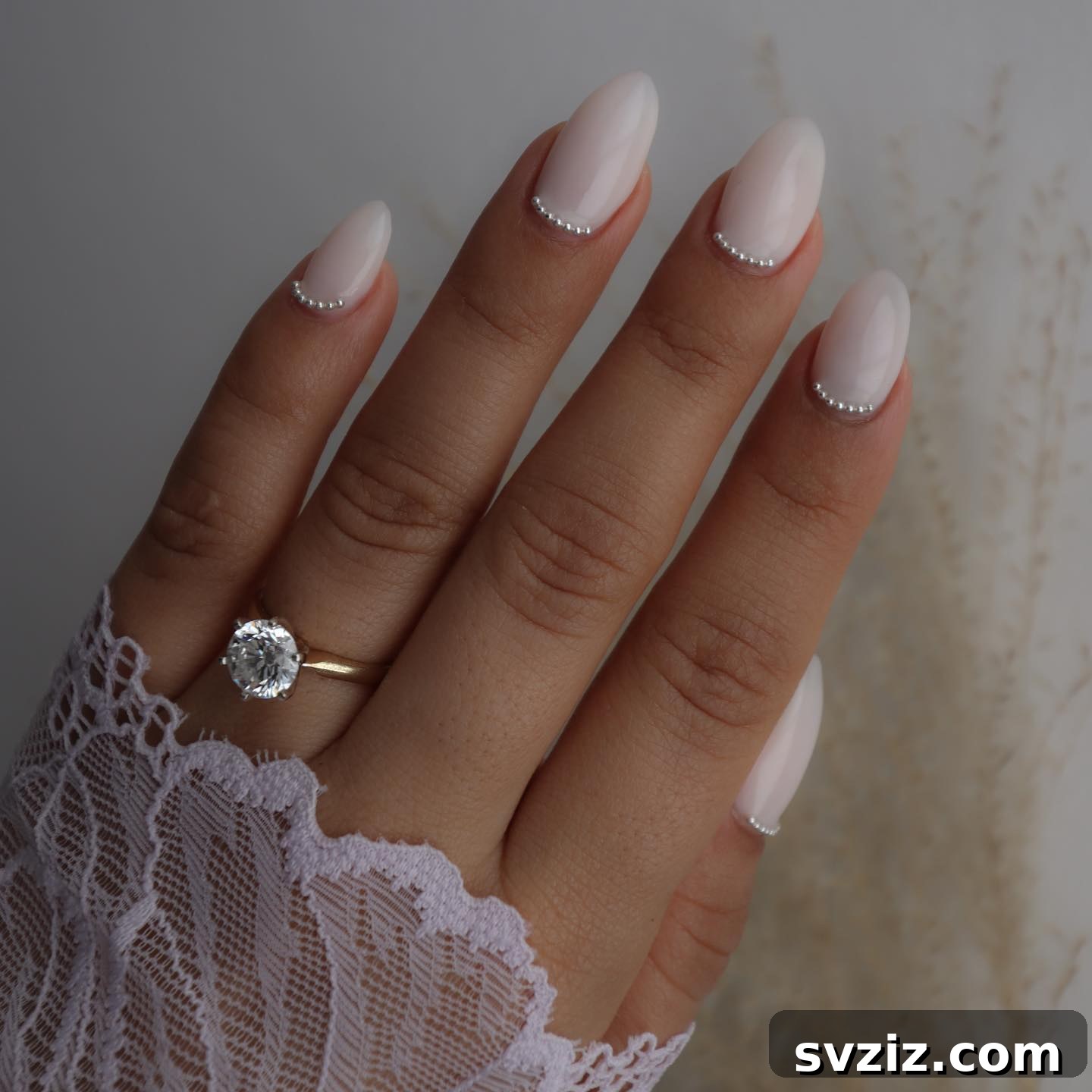 Stunning Bridal Nail Art Inspiration 31 Chic nude bridal nails with delicate rhinestone embellishments at the base
