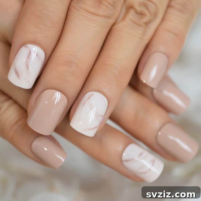 Stunning Bridal Nail Art Inspiration 33 Artistic marble-inspired wedding nails, a chic twist on white polish