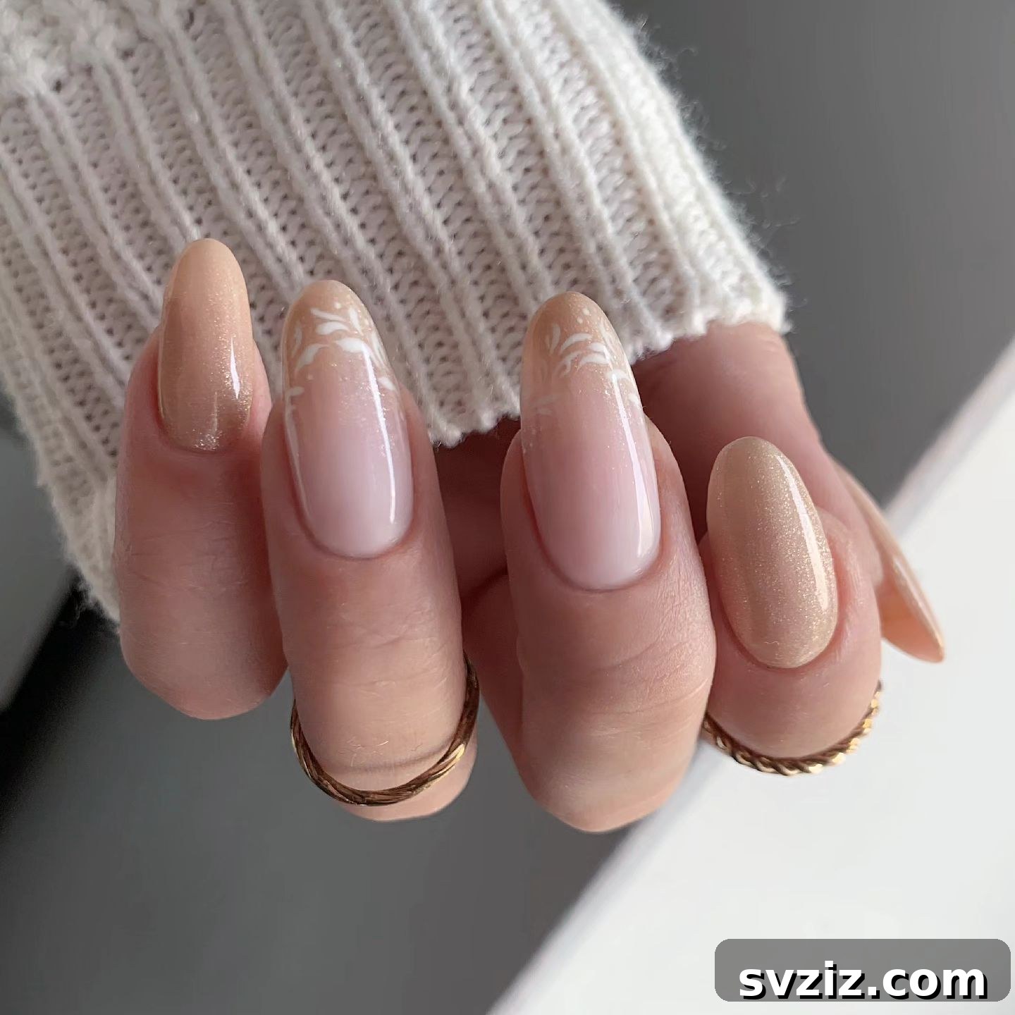 Stunning Bridal Nail Art Inspiration 37 Intricate wedding nail art combining sparkles, neutral tones, and delicate floral designs