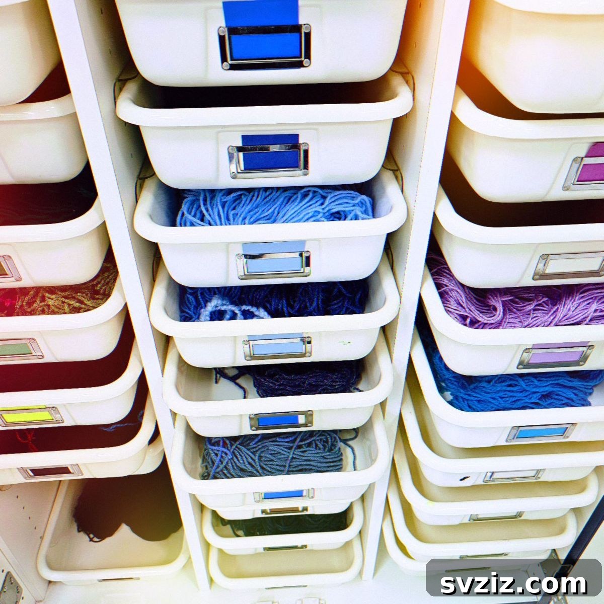 21 Ingenious Yarn Storage Solutions 14 Yarn neatly organized in a set of clear drawers, categorized for easy access.