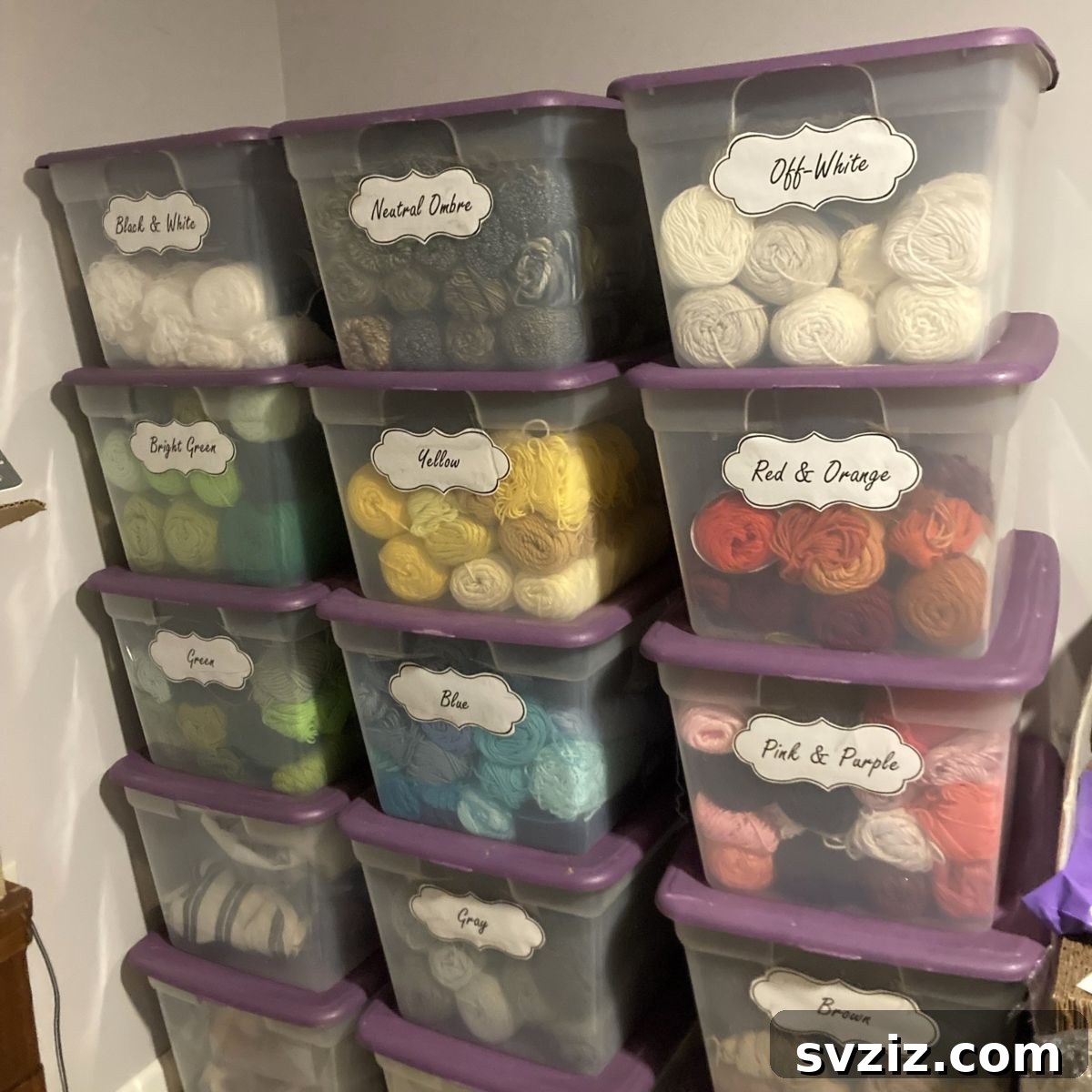 21 Ingenious Yarn Storage Solutions 19 Clearly labeled stackable storage bins filled with organized yarn, making categorization easy.
