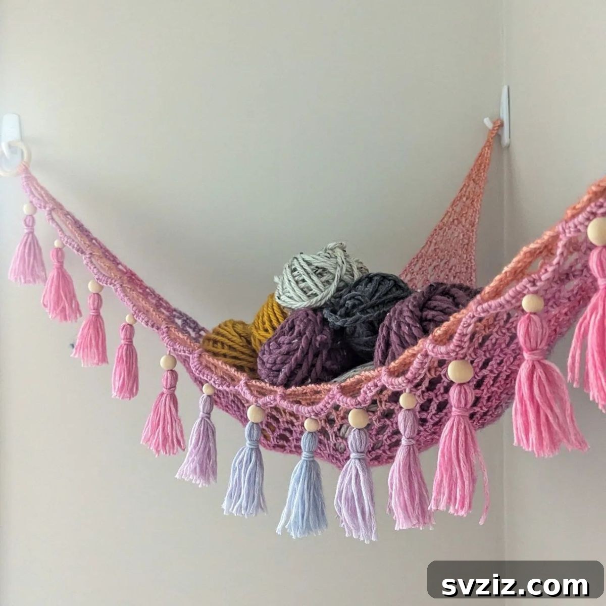 21 Ingenious Yarn Storage Solutions 7 A creative and beautiful yarn hammock displaying a colorful yarn collection.