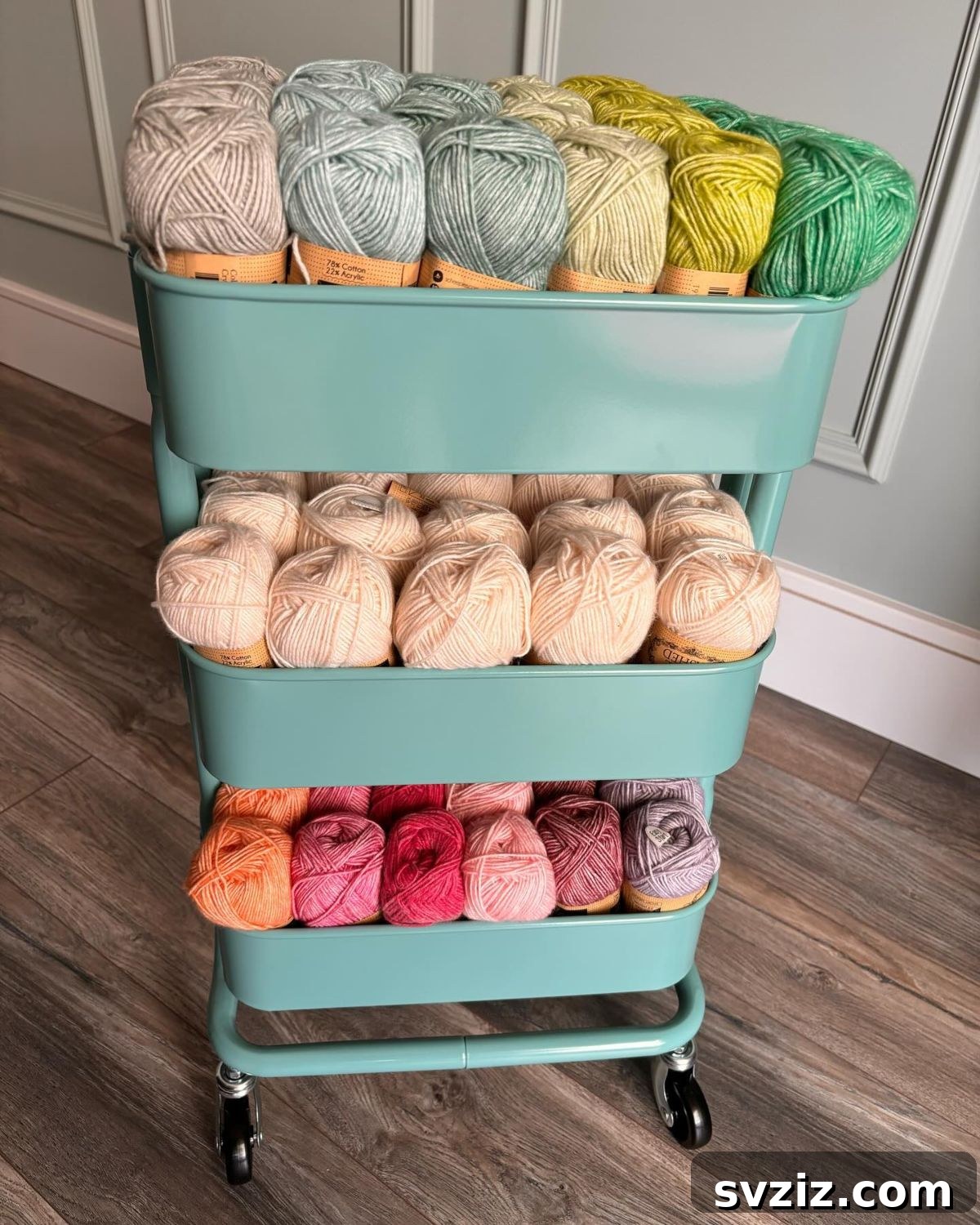 21 Ingenious Yarn Storage Solutions 8 A mobile yarn trolley with multiple tiers, filled with various colorful yarns.
