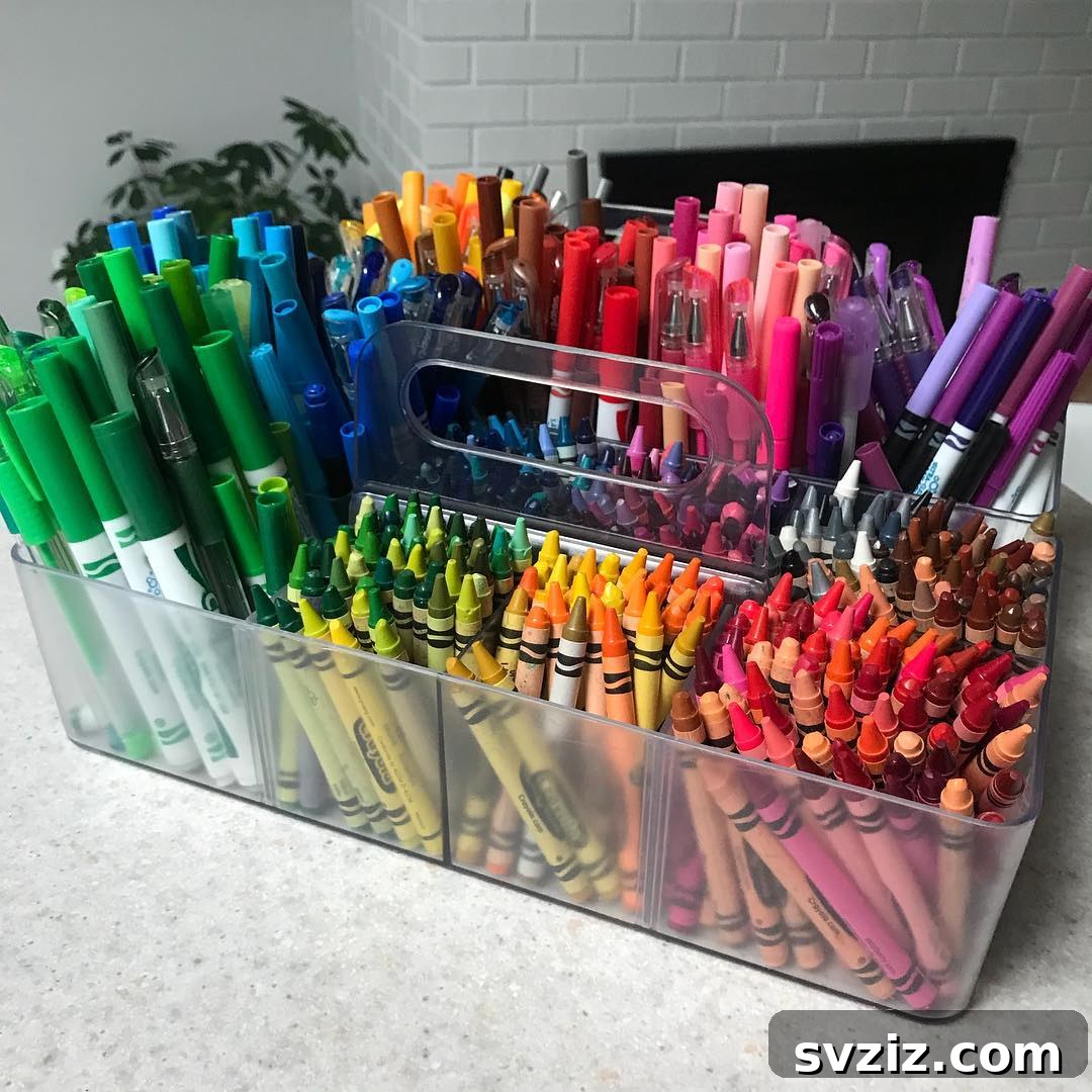 Unlock Creativity: Smart Organization for Your Art Studio 14 An acrylic crayon and marker caddy, filled to the brim with colorful art supplies, ideal for group activities in an art room. The multi-section design helps keep colors organized and accessible for students, whether on a table or carpet.
