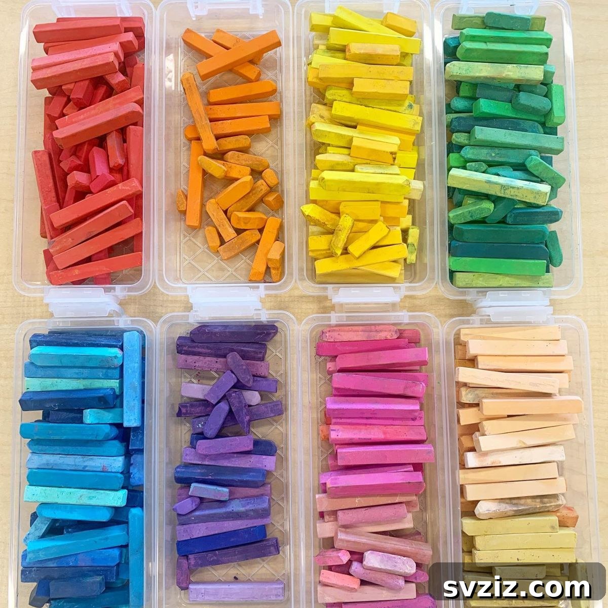 Unlock Creativity: Smart Organization for Your Art Studio 20 Pastel dividers made of clear acrylic, organizing a collection of pastels by color in an art room. This systematic storage solution prevents mixing, keeps colors distinct, and maintains the integrity of delicate art supplies, ideal for artists and students.