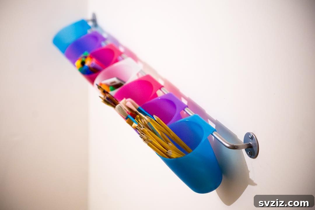 Unlock Creativity: Smart Organization for Your Art Studio 22 A hanging towel organizer repurposed with plastic buckets hooked onto the rail, creating vertical wall storage for art supplies. This DIY organizing solution maximizes wall space, keeping items like pens, brushes, and craft tools accessible and off countertops.