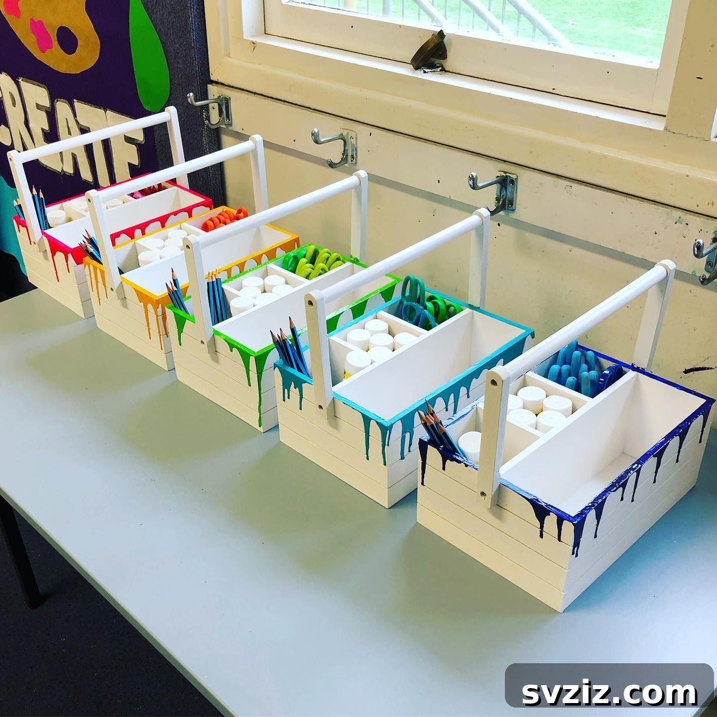 Unlock Creativity: Smart Organization for Your Art Studio 9 Colorful painted table caddies in an art classroom, organized with various art supplies like brushes, pencils, and paints. These caddies promote organization at each table, making materials accessible and cleanup easy, and can be decorated by students.