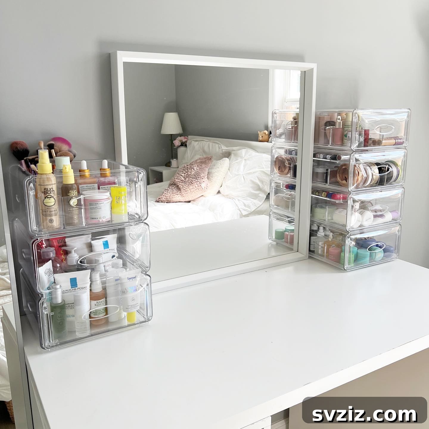 21 Ingenious Vanity Organization Hacks for a Tidy Space 11 Vanity setup featuring two identical stacked acrylic organizers flanking a mirror, creating symmetry.