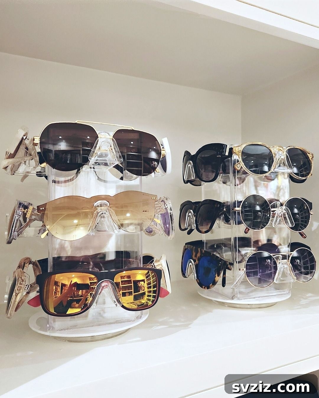 21 Ingenious Vanity Organization Hacks for a Tidy Space 14 Clear acrylic organizer displaying multiple pairs of sunglasses in separate compartments.