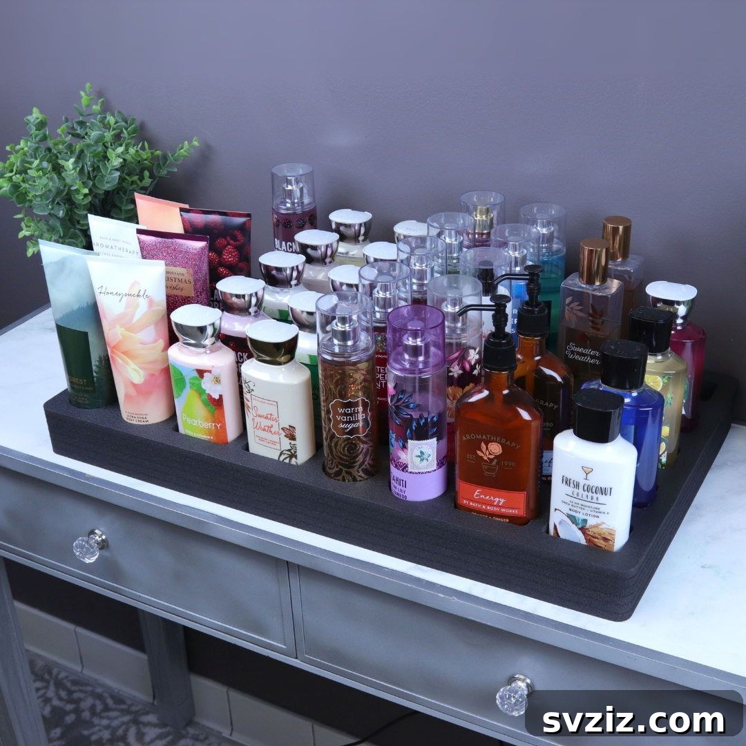 21 Ingenious Vanity Organization Hacks for a Tidy Space 22 Drawer with custom foam inserts organizing a collection of perfume bottles securely.