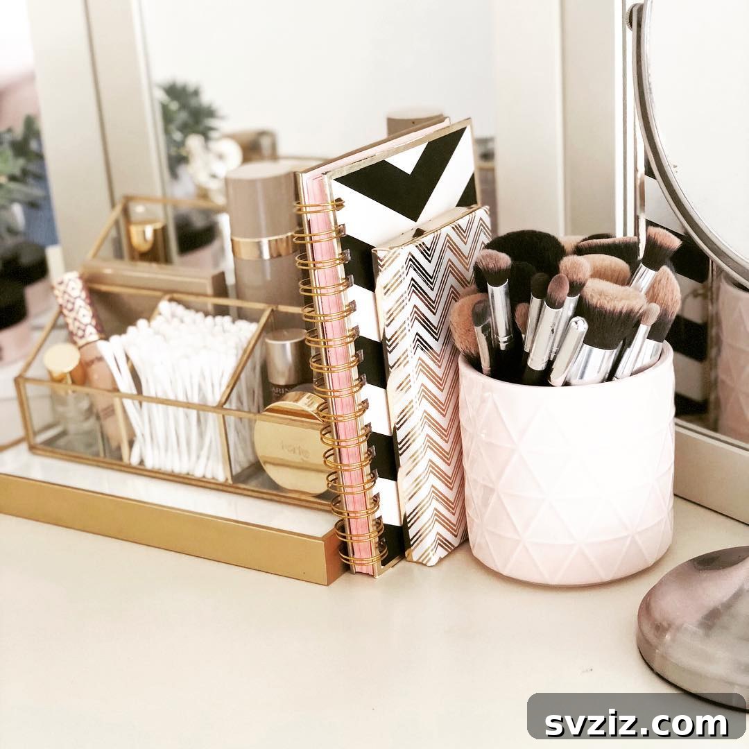 21 Ingenious Vanity Organization Hacks for a Tidy Space 6 Chic glass and gold organizer on a vanity, holding beauty essentials like cotton swabs and perfume.