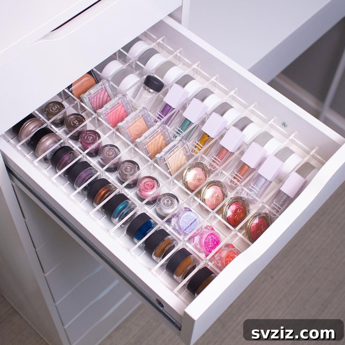 21 Ingenious Vanity Organization Hacks for a Tidy Space 9 Drawer with specialized acrylic dividers perfectly organizing individual eyeshadows and small palettes.