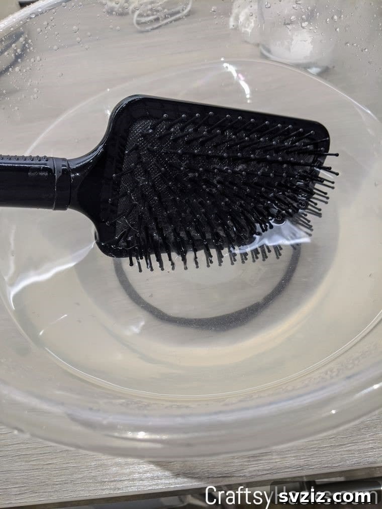 Cleaning hairbrushes with a baking soda soak for hygiene