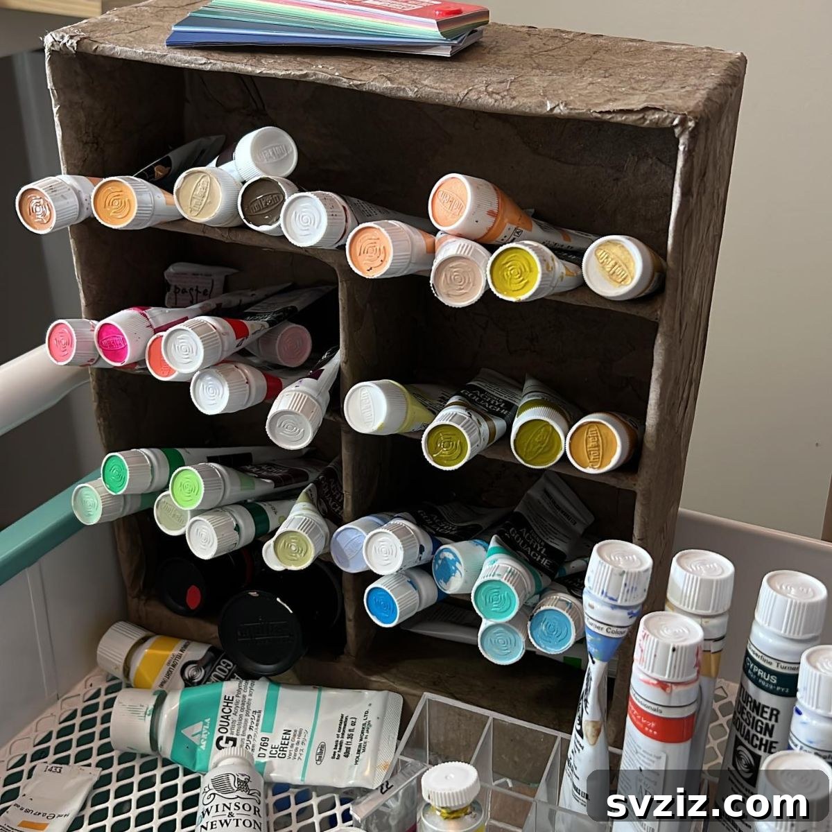 21 Genius Cardboard Hacks for an Organized Home 11 Cardboard Organizer for Craft Paint Tubes and Bottles