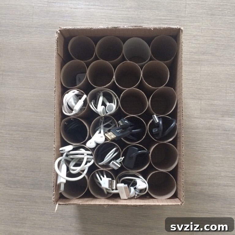 21 Genius Cardboard Hacks for an Organized Home 16 Cardboard Box and Tube Cord Organizer to Prevent Tangled Cables