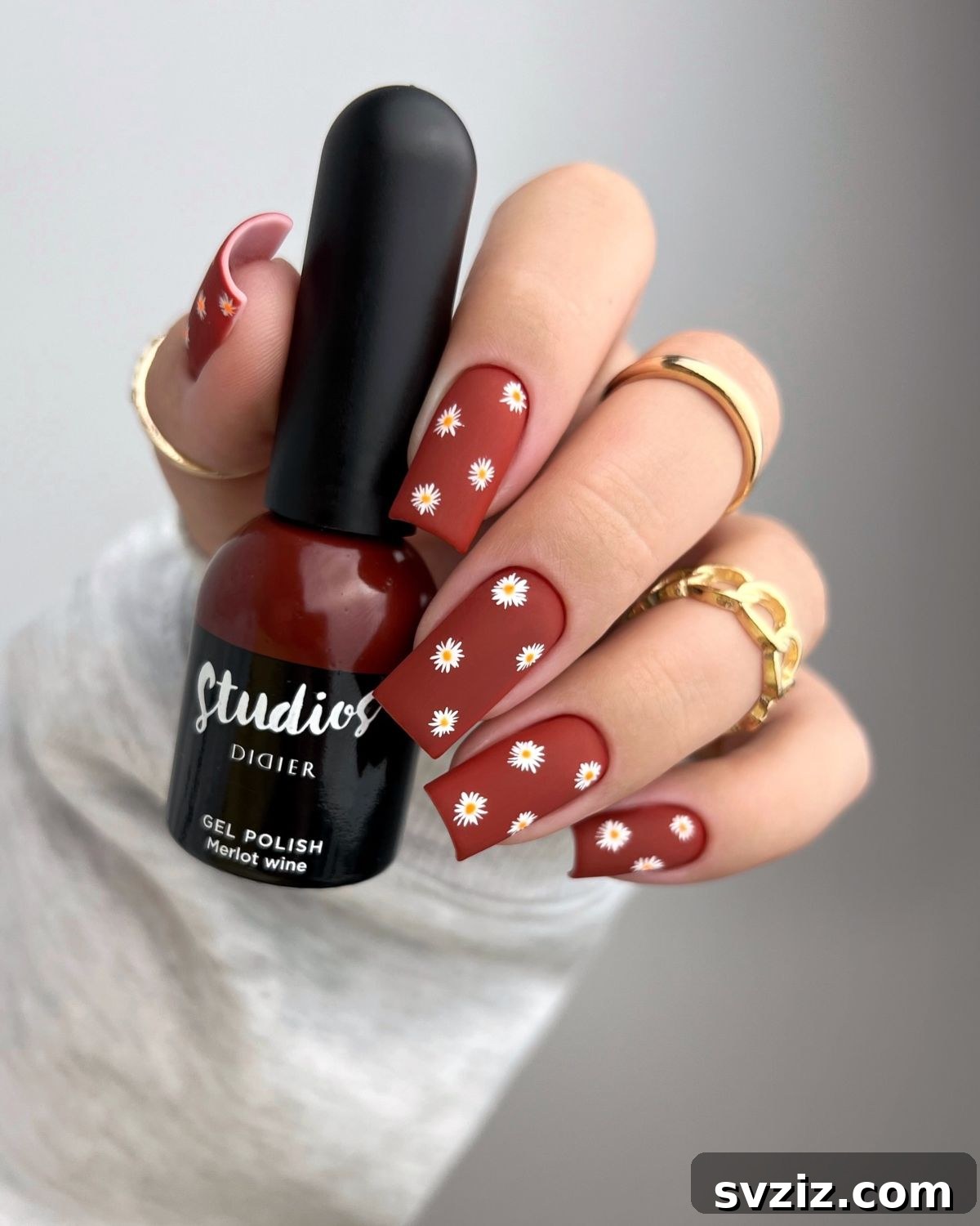 31 Chic Short Matte Nail Designs to Try Now 11 Short matte nails in a rich merlot wine shade, embellished with dainty floral patterns perfect for spring.