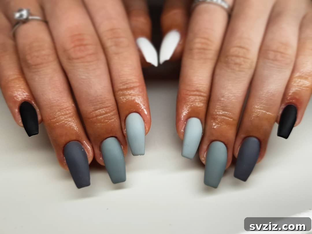 31 Chic Short Matte Nail Designs to Try Now 12 Short matte nails featuring a sophisticated blend of gray and black shades with varying tones.