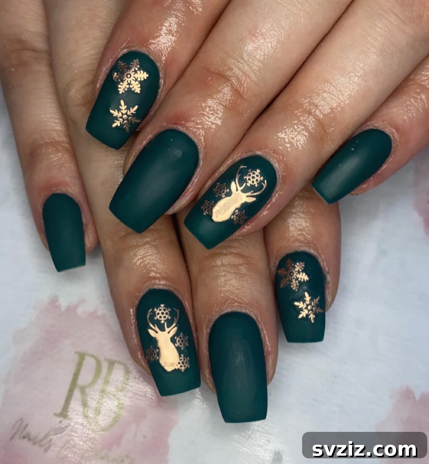 31 Chic Short Matte Nail Designs to Try Now 15 Christmas-themed short matte nails in a deep green with sparkling gold accents.