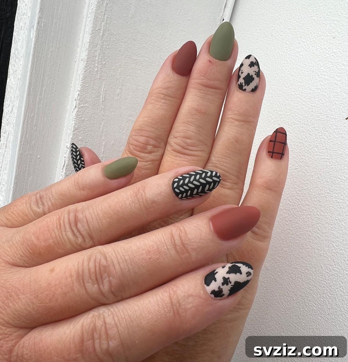 31 Chic Short Matte Nail Designs to Try Now 16 Diverse short matte fall manicure featuring greens, browns, blacks, whites, and a beautiful plaid design.