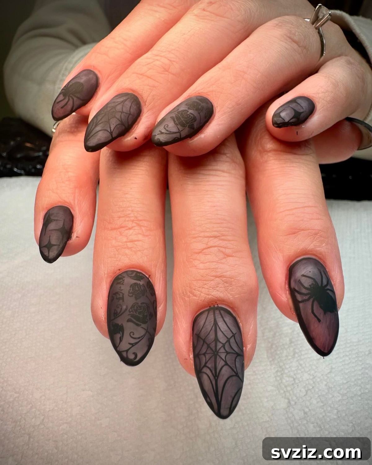 31 Chic Short Matte Nail Designs to Try Now 17 Striking short matte smoky black nails with intricate spooky designs, perfect for Halloween.