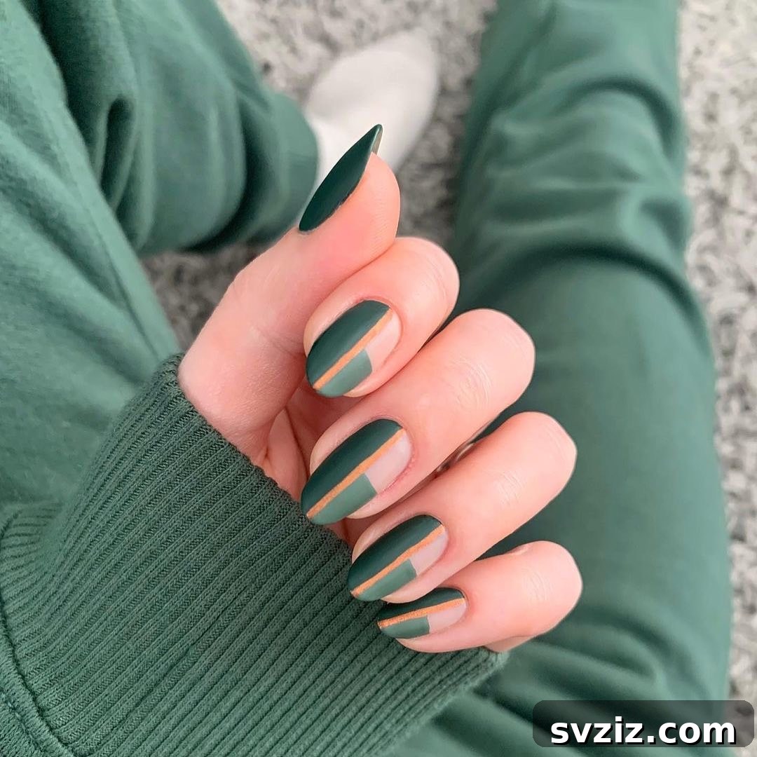 31 Chic Short Matte Nail Designs to Try Now 24 Stunning short matte green nails with a striking brown stripe in the center, creating an earthy and modern look.
