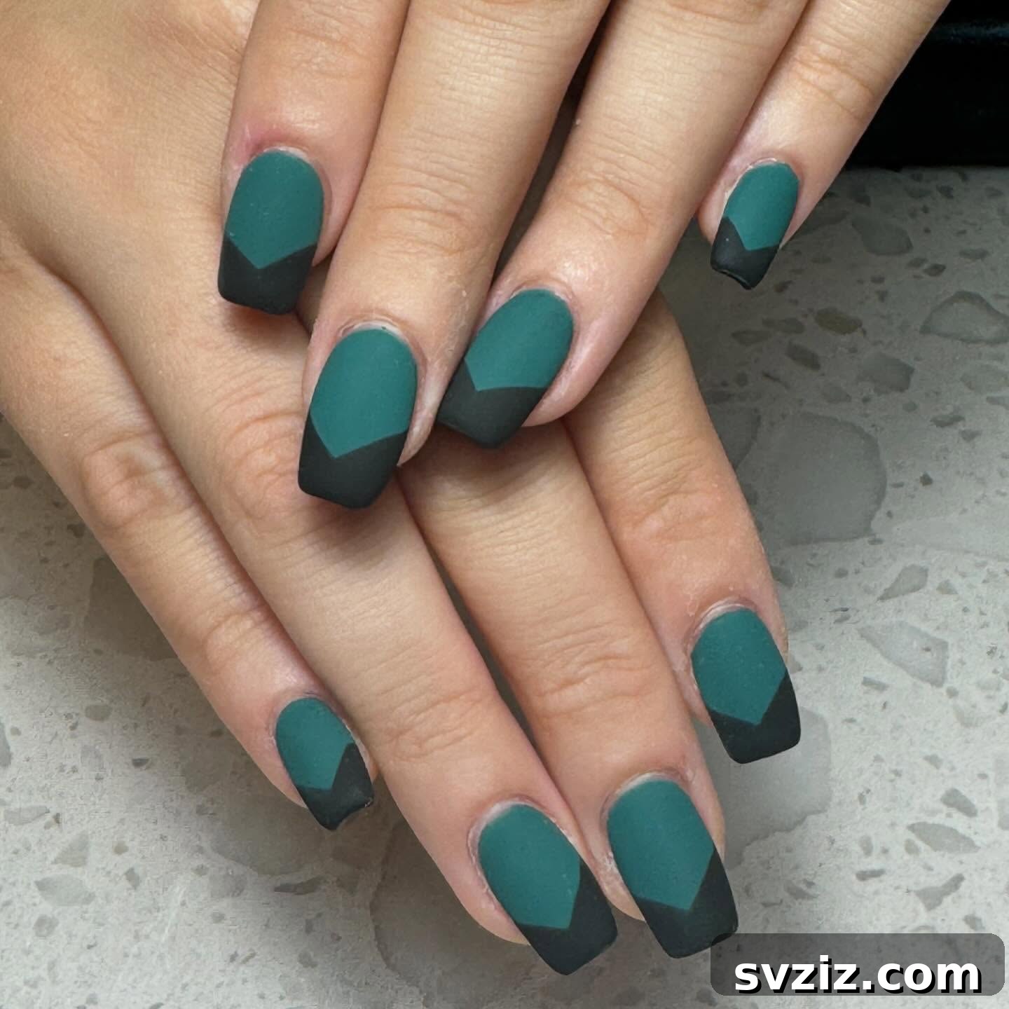 31 Chic Short Matte Nail Designs to Try Now 33 Beautiful short matte green nails with sharp black tips, creating a striking and modern contrast.