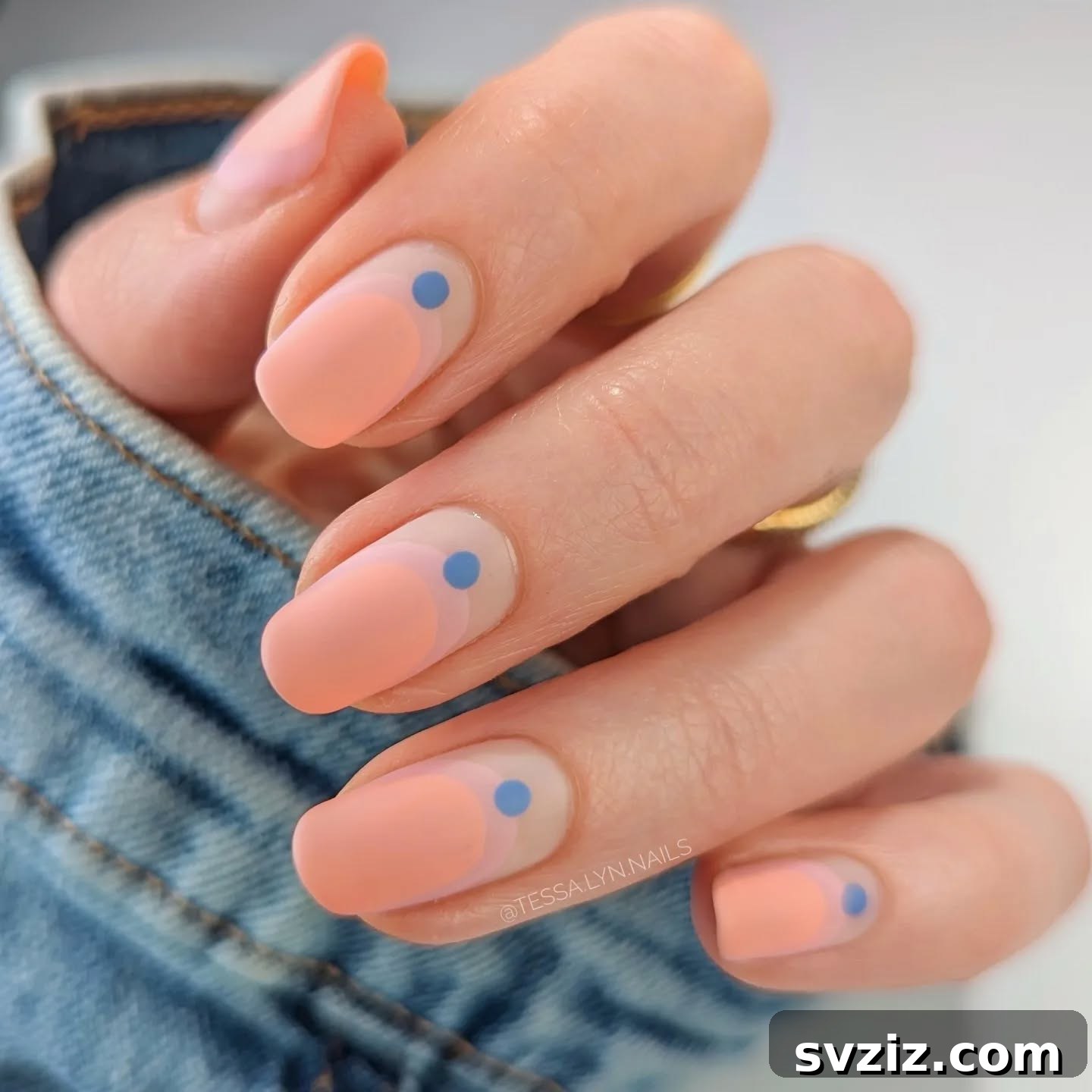 31 Chic Short Matte Nail Designs to Try Now 10 Minimalist short matte natural nails adorned with small, charming blue dots.
