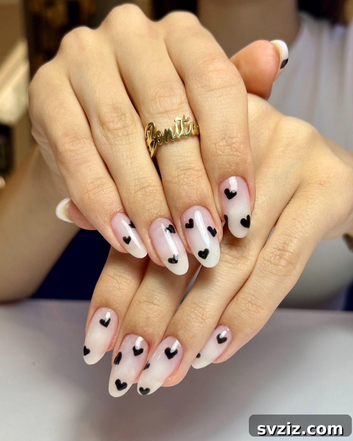 Adorable Pink Minimalist Nails with Delicate Black Hearts