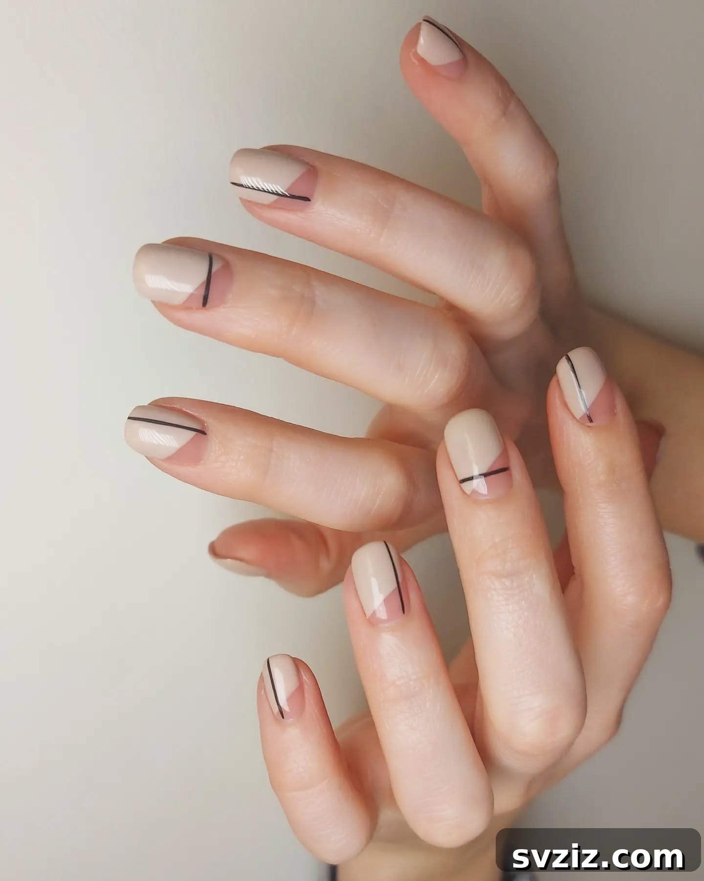 Neutral Minimalist Nails with Bold Black Stripe Accents